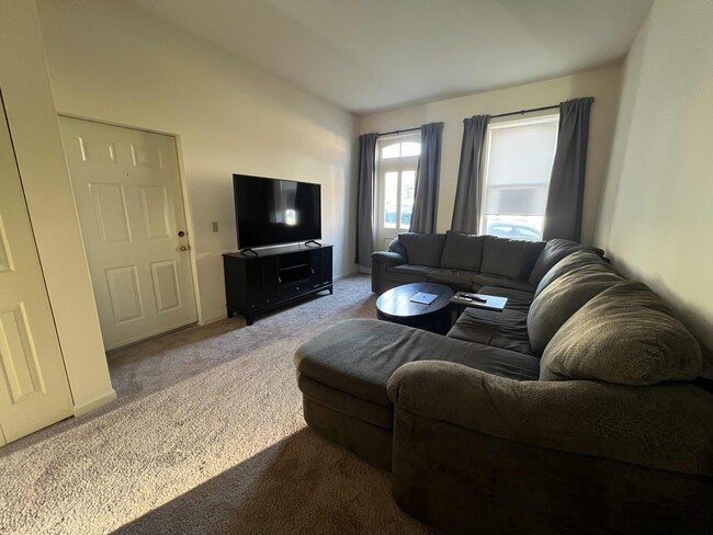 Large living room that fits a huge sectional with room to spare. - 906 Russell Blvd Unit Apartment B