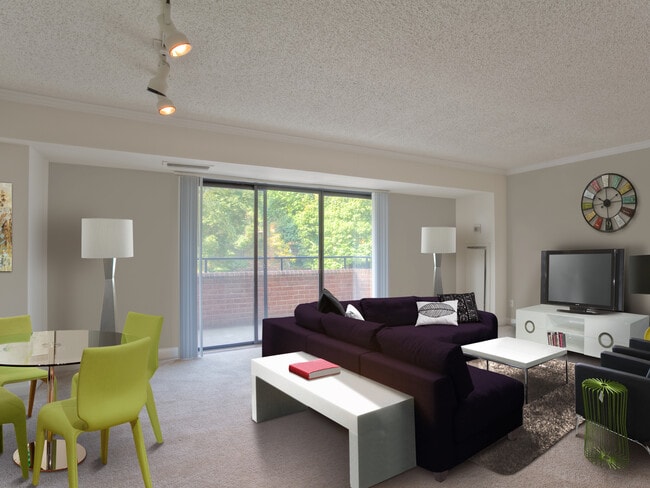 Living and dining areas with balcony access and carpeted flooring