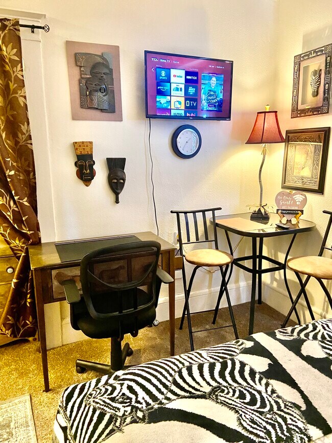 Each studio has either a desk or dining table or both - The Lindsay Furnished Apartments