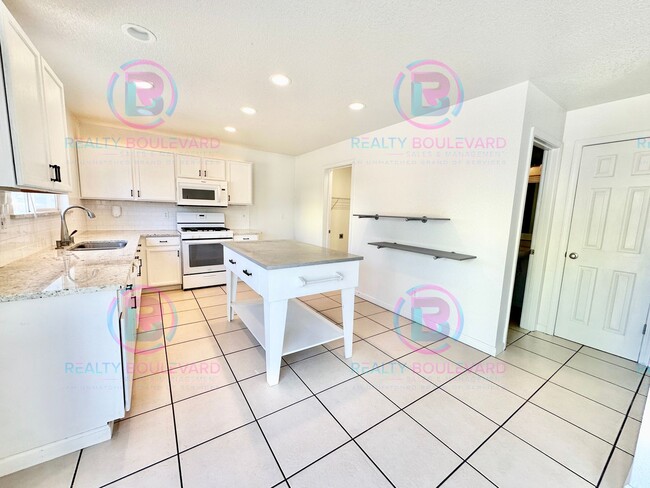 Photo - Gorgeous 4BR Home with Granite Counters, Open-Concept Living & 2 car garage