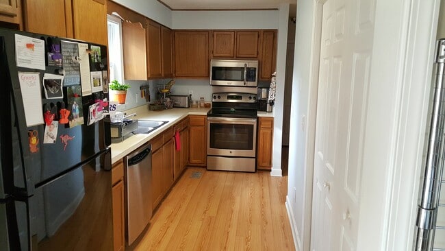 Kitchen being updated before move-in with granite, tile backsplash, new sink, & updated cabinets. - 3214 Lassiter St