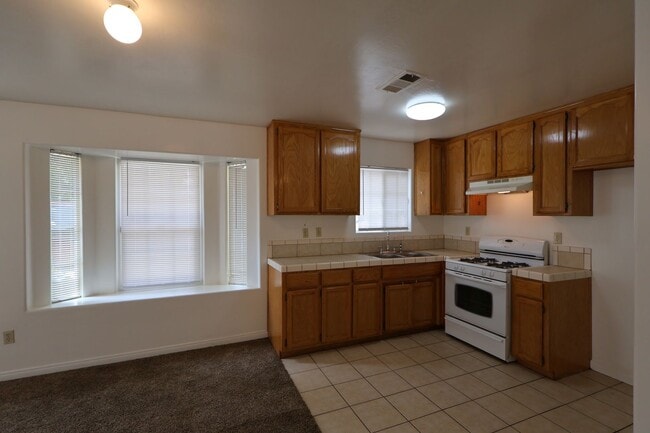 Photo - Spacious 3-Bedroom Duplex with Private Patio and Prime Location