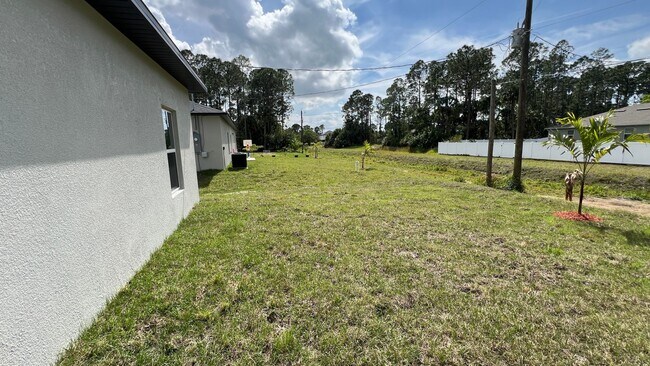 Photo - Smart & Stylish 3BD/2BA Palm Bay Home – Modern Upgrades, No Water Bills!