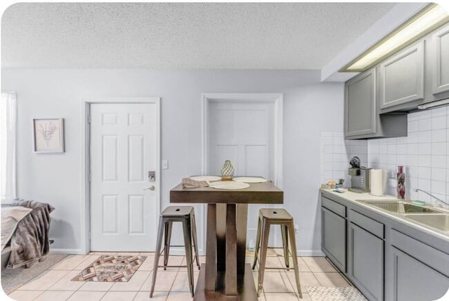 Photo - Furnished 1-Bedroom Apartment with Private Entrance and Free Laundry Unit 5