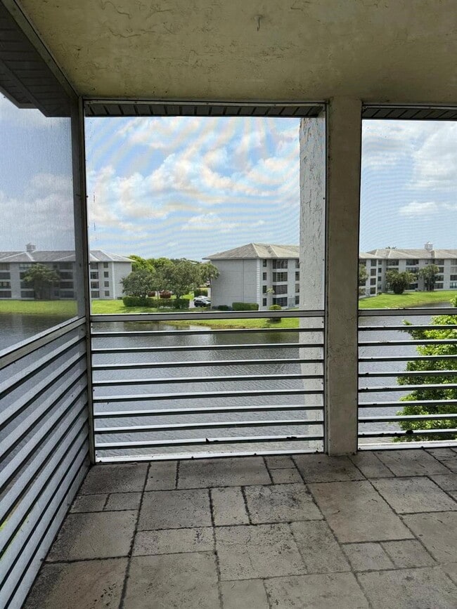 Building Photo - 9420 Poinciana Pl Unit #406 Rental