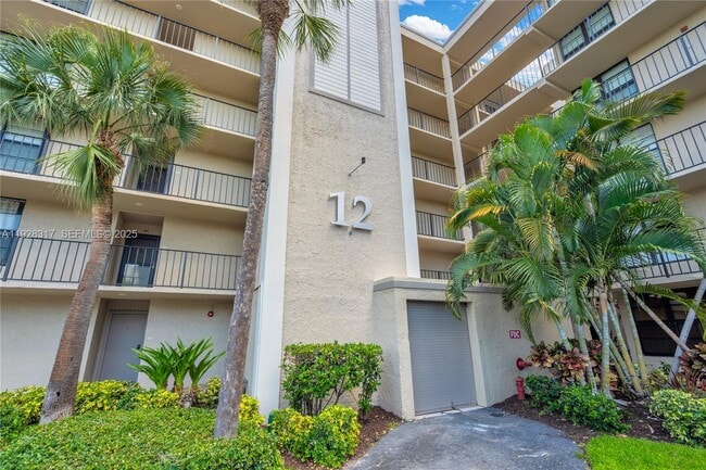 Building Photo - 12 Royal Palm Way Unit 103