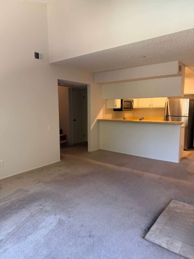 Photo - Spacious 3-Bedroom, 2-Bath Multi-Level Home with Balcony, In-Unit Laundry & Dual Parking