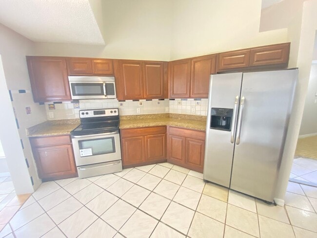 Photo - 3 Bed 2 Bath Home with Stainless Steel Appliances Near Poinciana Pkwy!