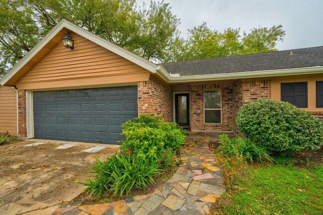 Photo - This charming 3-bedroom, 2-bathroom oasis ...