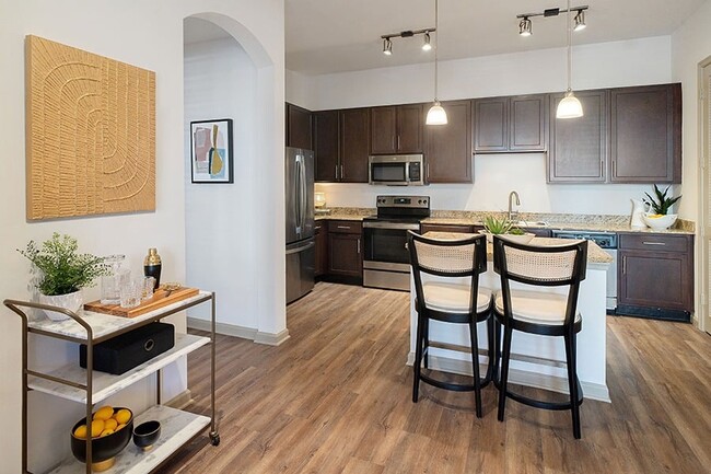 Open layouts with kitchen islands available - Dwell at McEwen Apartments