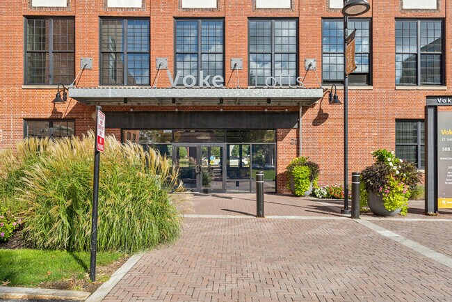 Main entrance to Voke Lofts featuring modern design and welcoming resident access