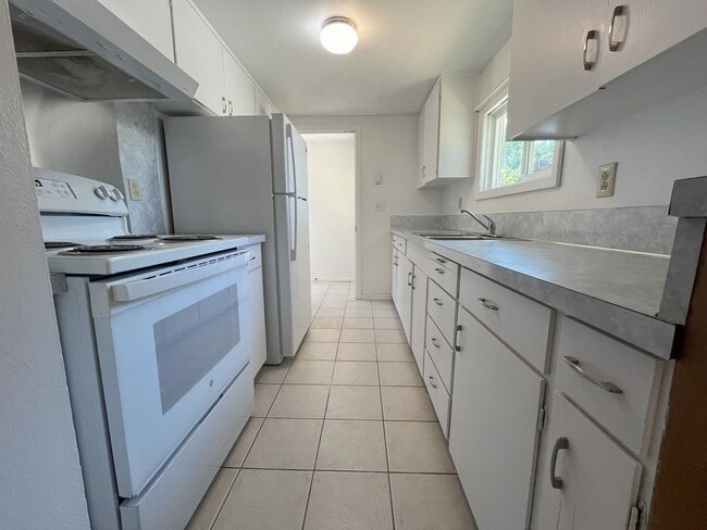 Photo - Charming 2-Bedroom Home with Open Living Space and Tile Flooring