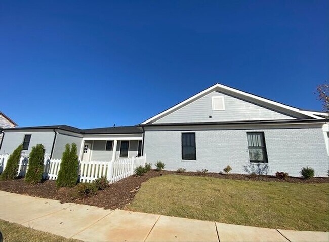 Photo - Clift Farm townhome with a fence and 3 car garage