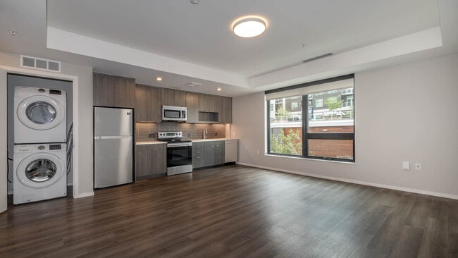 Kitchen with Stainless Steel Appliances and In-home Washer and Dryer