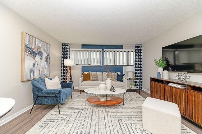 Spacious living room with hardwood-style flooring - Vetra Lexington