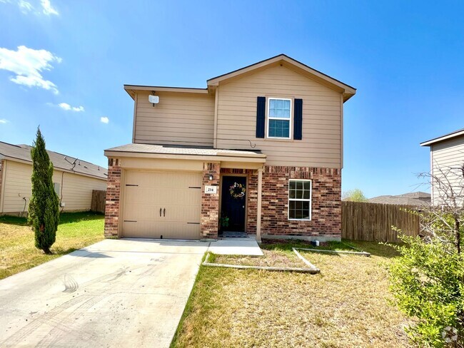 Building Photo - Home with fenced in backyard and covered b...