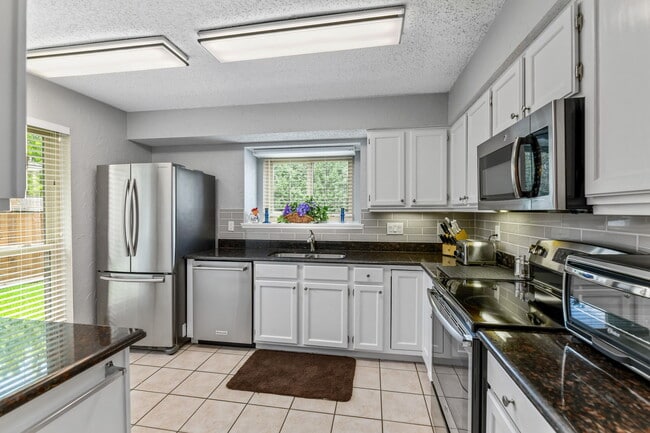 Extensively provisioned kitchen w/ modern stainless steel appliances