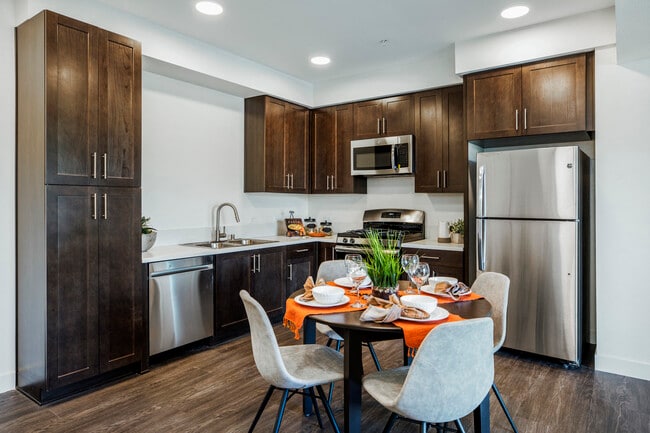 The Harrington dining table and kitchen with appliances