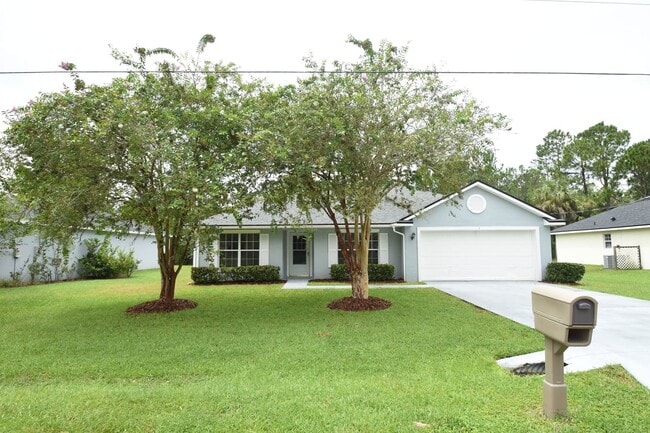 Building Photo - Fenced yard at this spacious 4-Bedroom Oasis with 2 Baths in Charming Palm Coast Retreat!