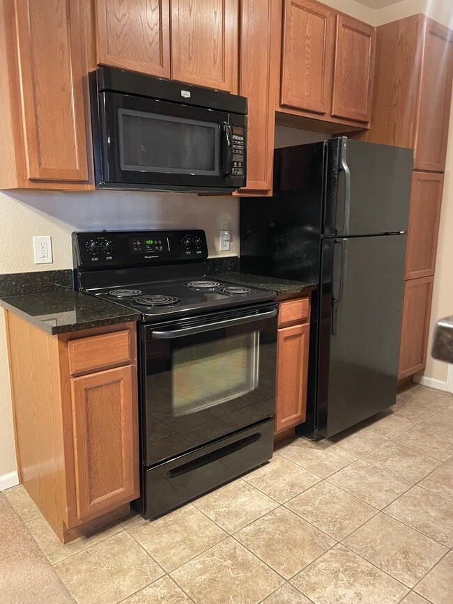 Kitchen with granite counter tops - 1465 Blue Sky Cir Unit 17-104