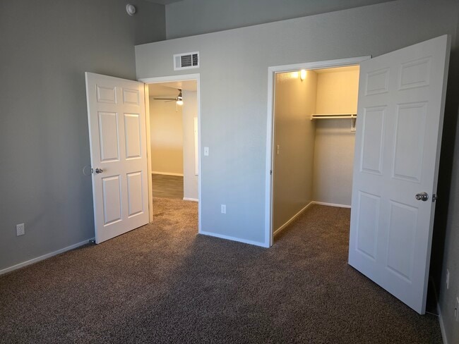 Lily Upstairs Bedroom facing the door and walk-in closet