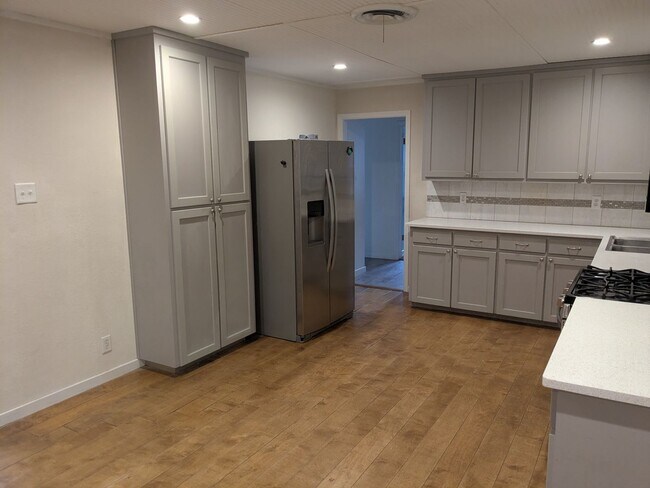 Photo - Spacious 4 Bed 2 Bath with Enclosed Patio and Stainless Steel Appliances