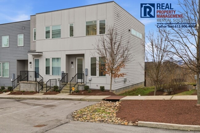 Building Photo - Lovely 2BR/1.5BA end unit townhome 5 mins from Downtown Nashville with washer/dryer included!