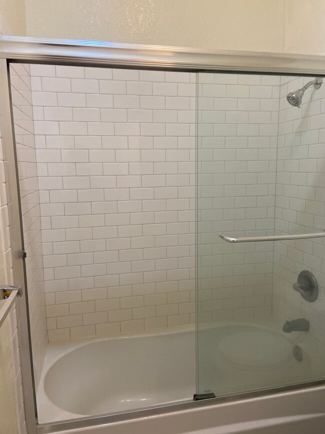 Renovated full bathroom #1 with subway tile and tub/shower combo - 4179 Shafter Ave