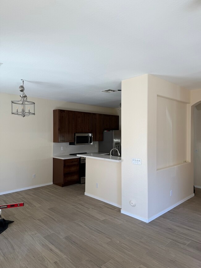 Living room looking into kitchen - 2600 E Springfield Pl