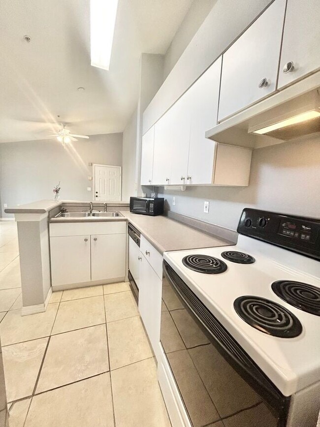 Photo - Bright 3rd-Floor 1/1 Condo with Screened Balcony in Park Central!