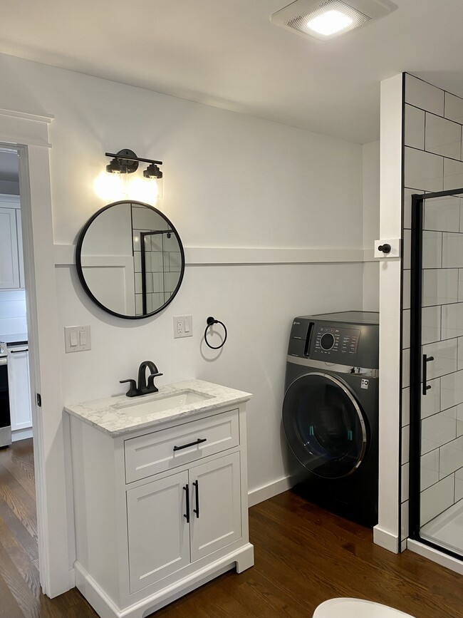 Bathroom with washer and dryer combo unit. - 22 Denmore Ln