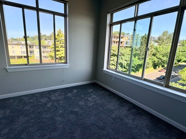 Photo - Top-Floor Corner 2BR with Lake Union Views + Garage Parking Included!