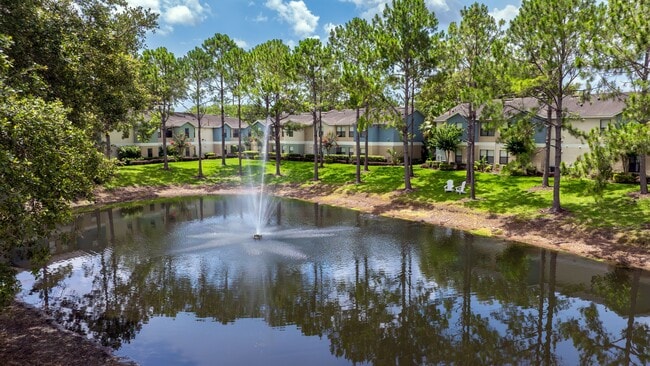 Enjoy the relaxing sounds of the fountain and the serene beauty of nature, right outside your door at Harper Grand. - Harper Grand