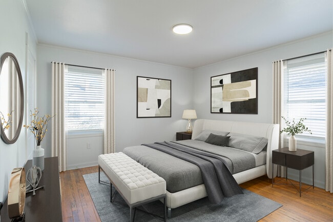 Generous Bedrooms featuring original hardwood flooring.