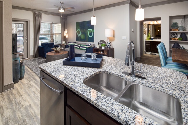Kitchen, living, and dining areas with hard-surface flooring