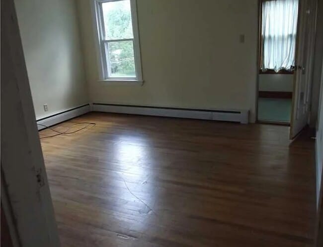 Living room sunroom to the right front of building - 6 Hallowell St Unit 3