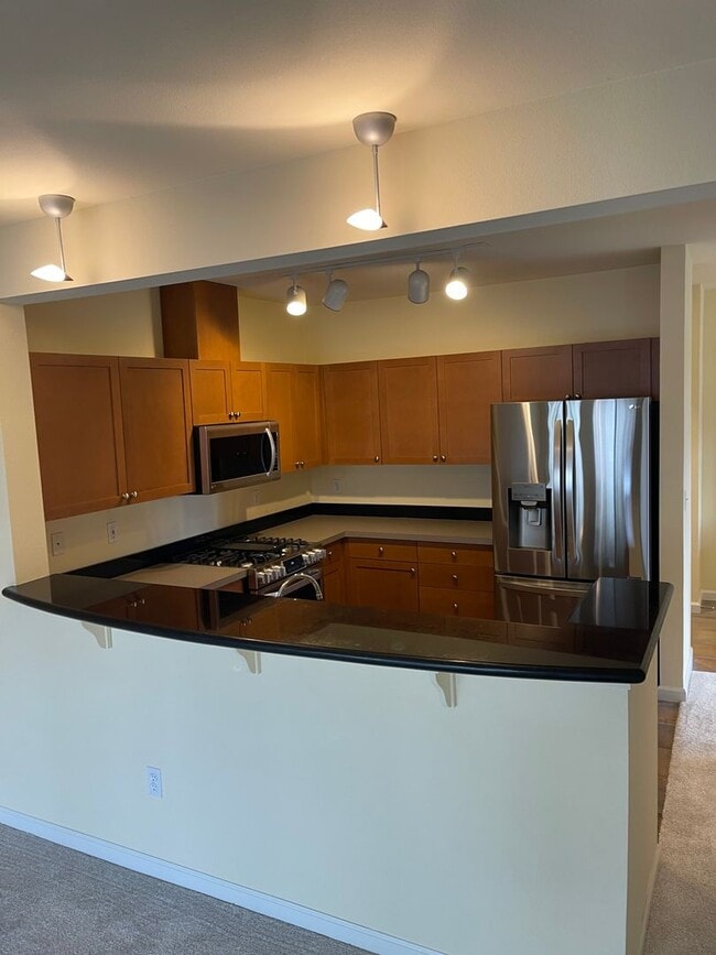 Photo - Updated Condo with Parking for One, Great Location and Communal Roof-top Deck!!