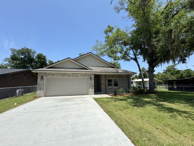 Building Photo - "Charming 4 Bed, 2 Bath Home with Granite ...