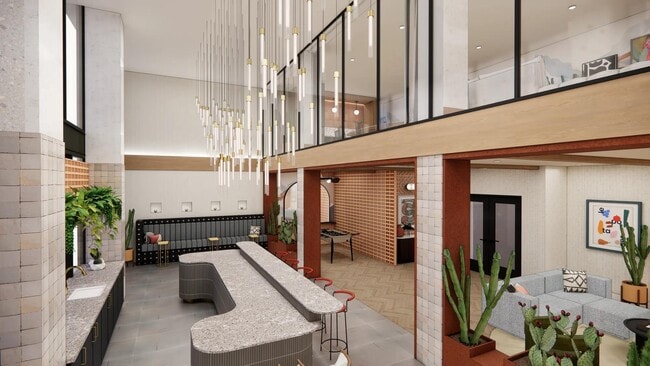 Entertain guests in the clubroom featuring a gathering space and bar area. - Modera Rio Salado