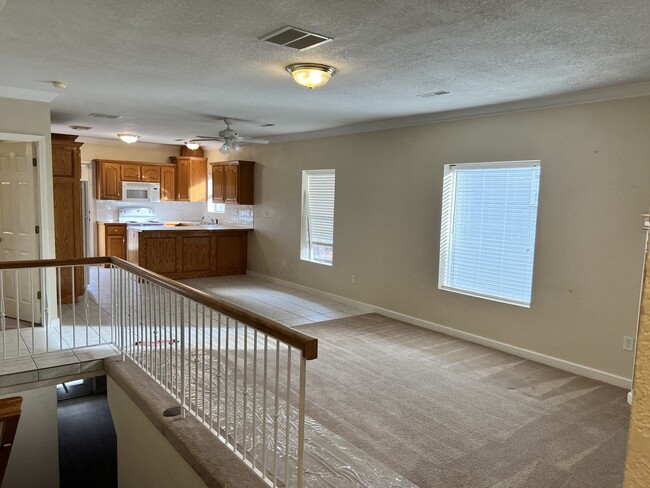 Upstairs living room and kitchen - 619 Davis St Townhome