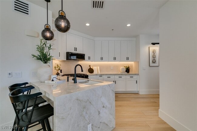 Building Photo - 8777 W Maule Ave Unit 1002