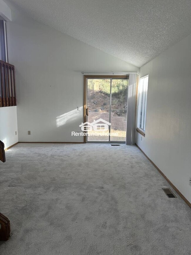 Photo - Bright living room, all stainless steel kitchen appliances, brand-new stove, washer and dryer, ne...