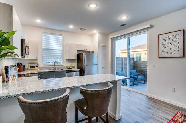 Kitchen with Sliding Door to Private Yard - Estates at Plum Creek Rental