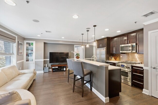 Building Photo - 1331 Grand St Unit 207