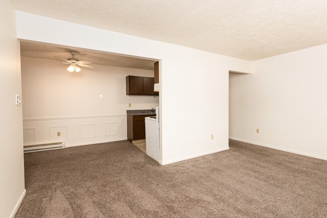 Dining Area / Kitchen view from Living Room. - Blue Spruce Apartments