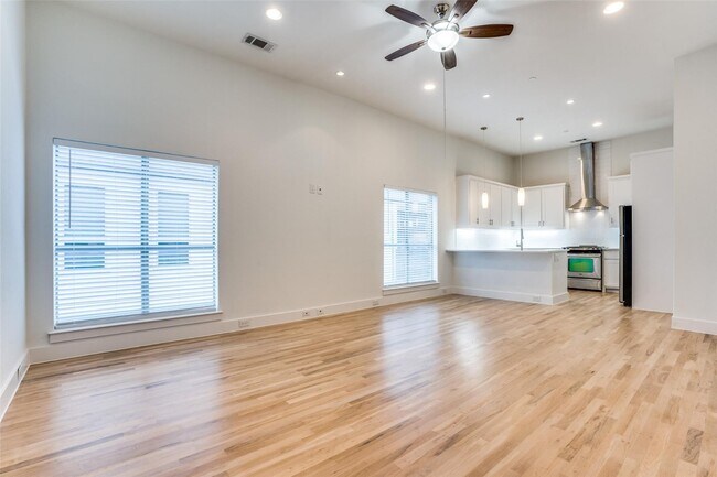 Photo - Beautiful townhome featuring granite countertops, hard wood floors, and a small private yard grea...