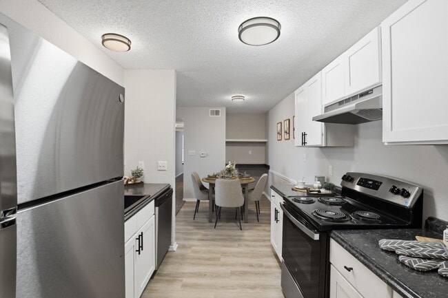 Fully equipped kitchen with ample cabinet and counter space.
