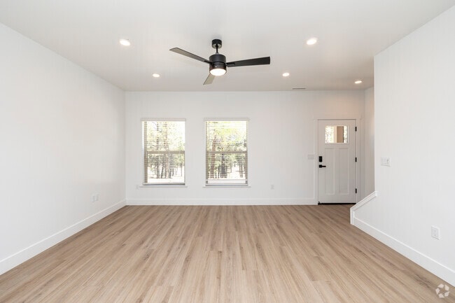 3BR, 2.5BA - 1,442SF - Living Room - Canyon Del Rio Village Apartments + Townhomes