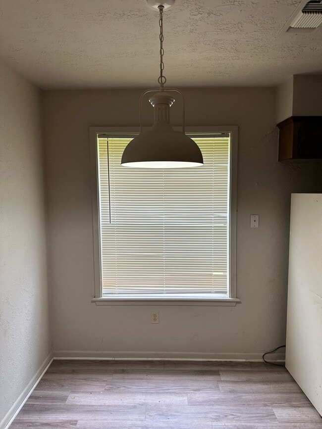 Photo - Bryan - 1 bedroom / 1 bath - duplex - fenced in area behind unit. Near 29th street.