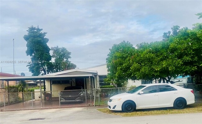 Building Photo - 6831 SW 2nd St Unit front
